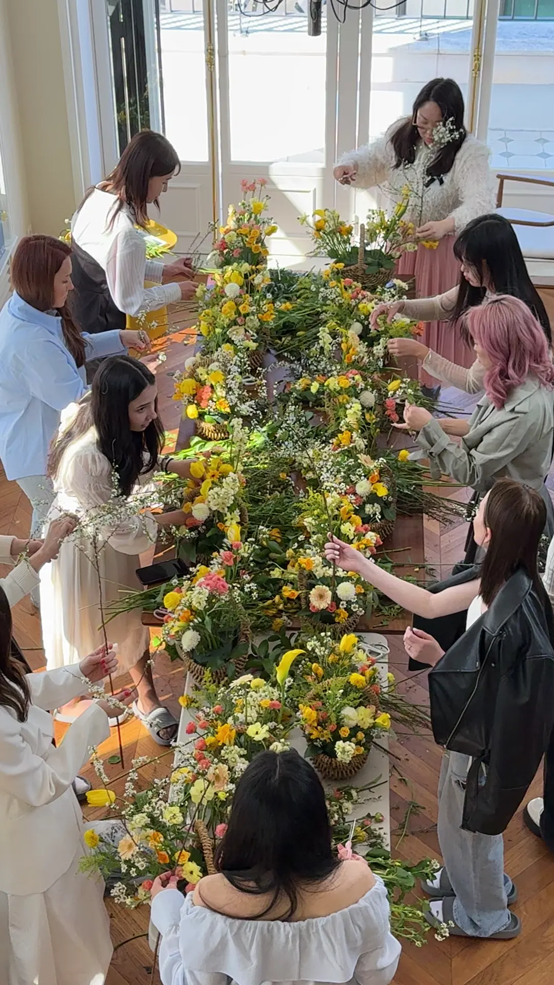 Women working together around the flower table