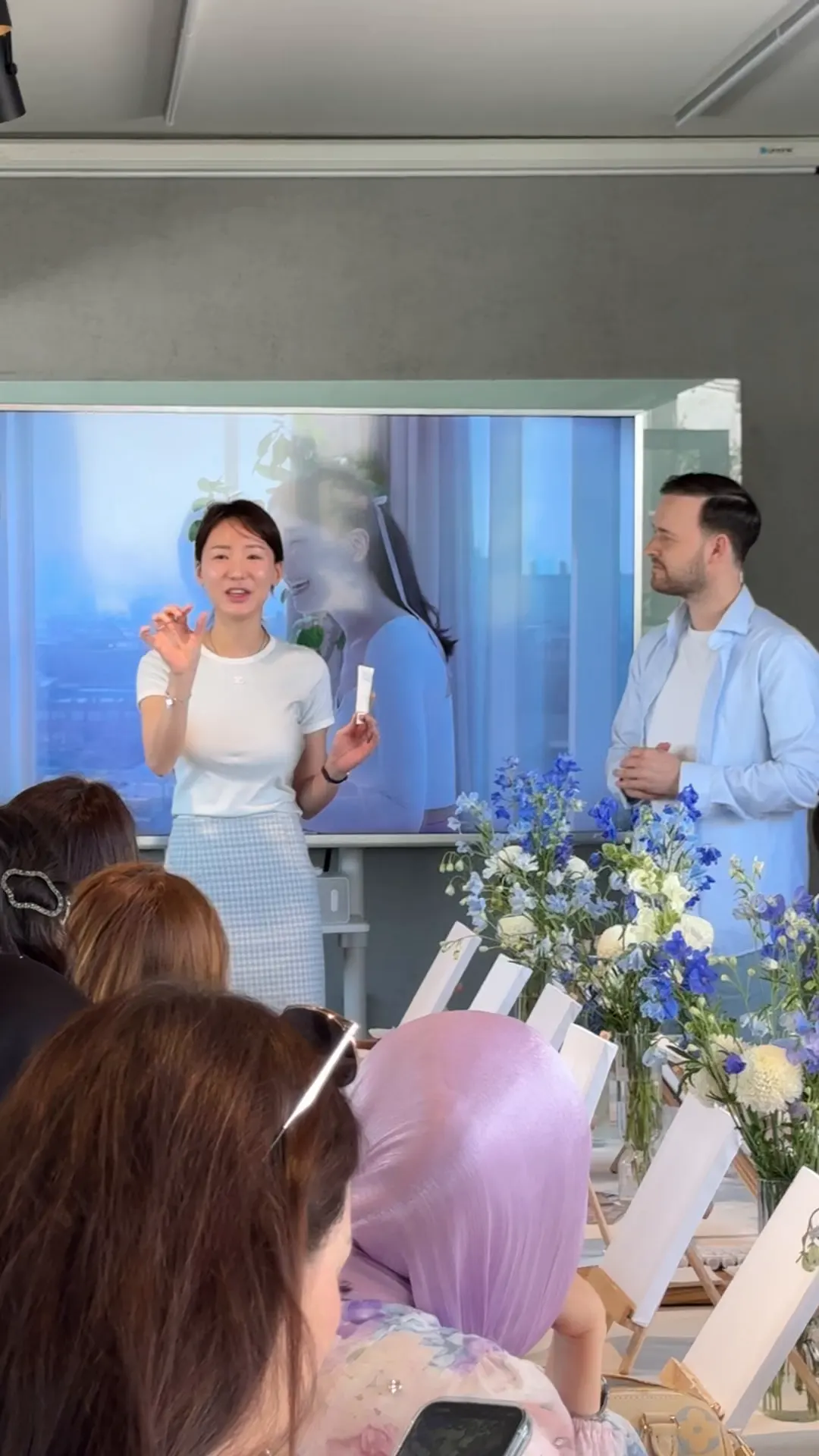 Host presenting during the painting event