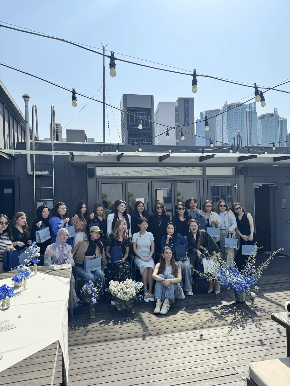 Large group portrait after the Seoul Lady rooftop painting gathering